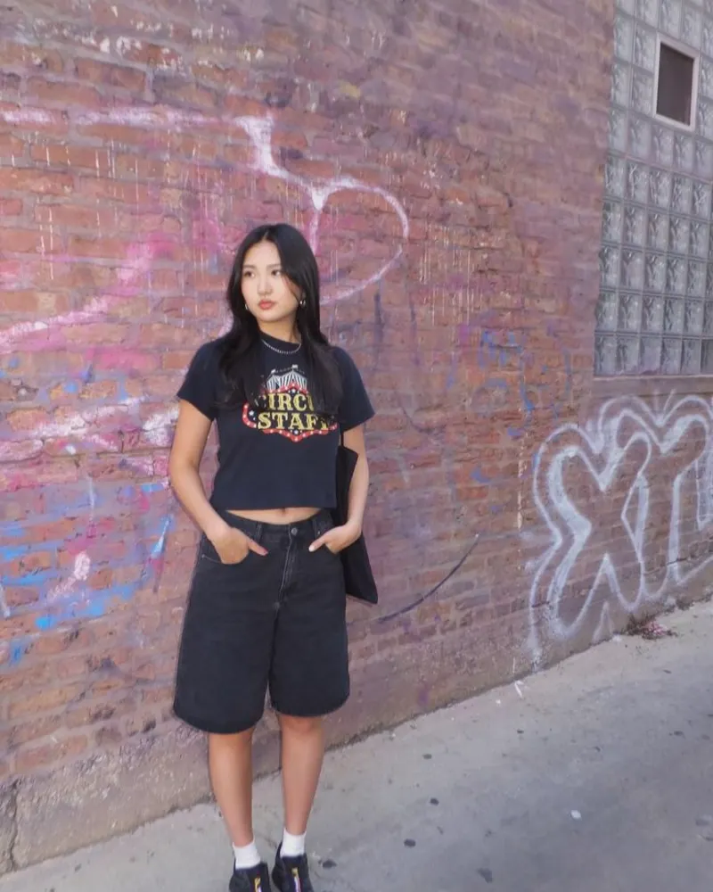  Black Vintage Graphic Crop Tee and Black Wide-Leg Denim Shorts with Black Sneakers