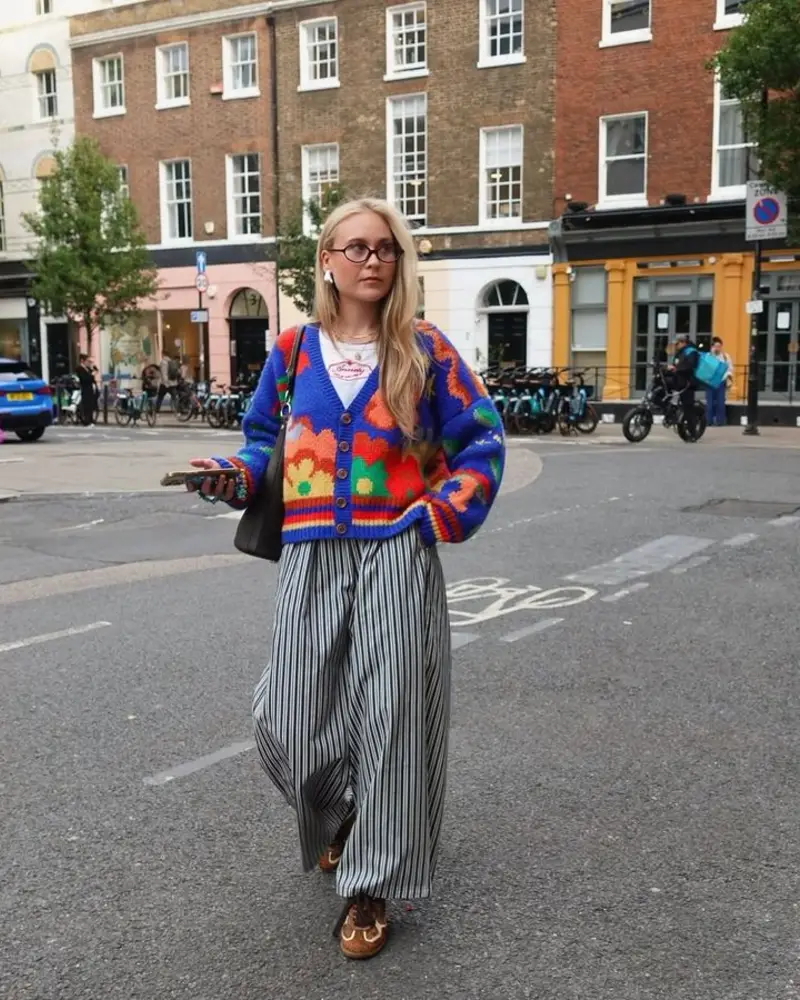 Bold Multicolor Floral Cardigan Over White Tee With Striped Wide-Leg Trousers