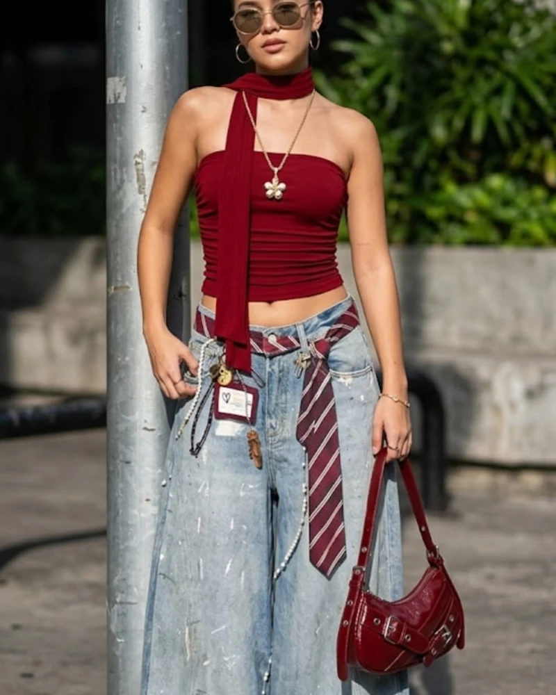 Burgundy Halter Neck Crop Top with Paint-Splattered Baggy Jeans and Red Accessories