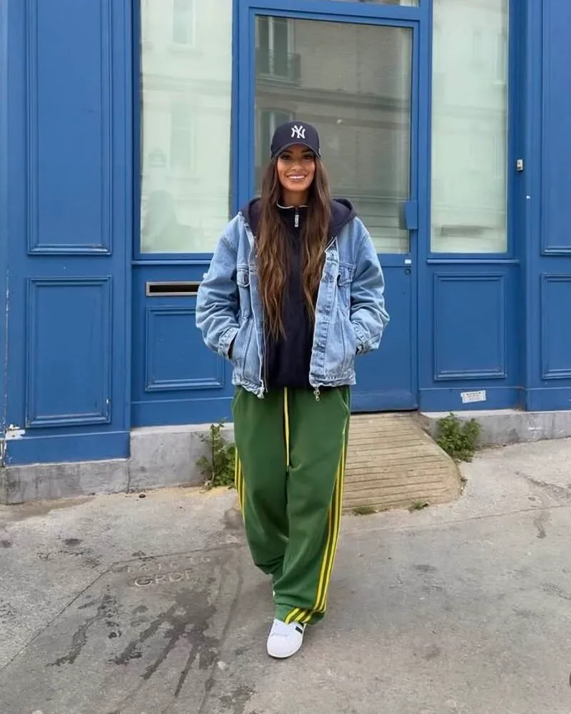 Denim Jacket Over Black Hoodie With Green Track Pants