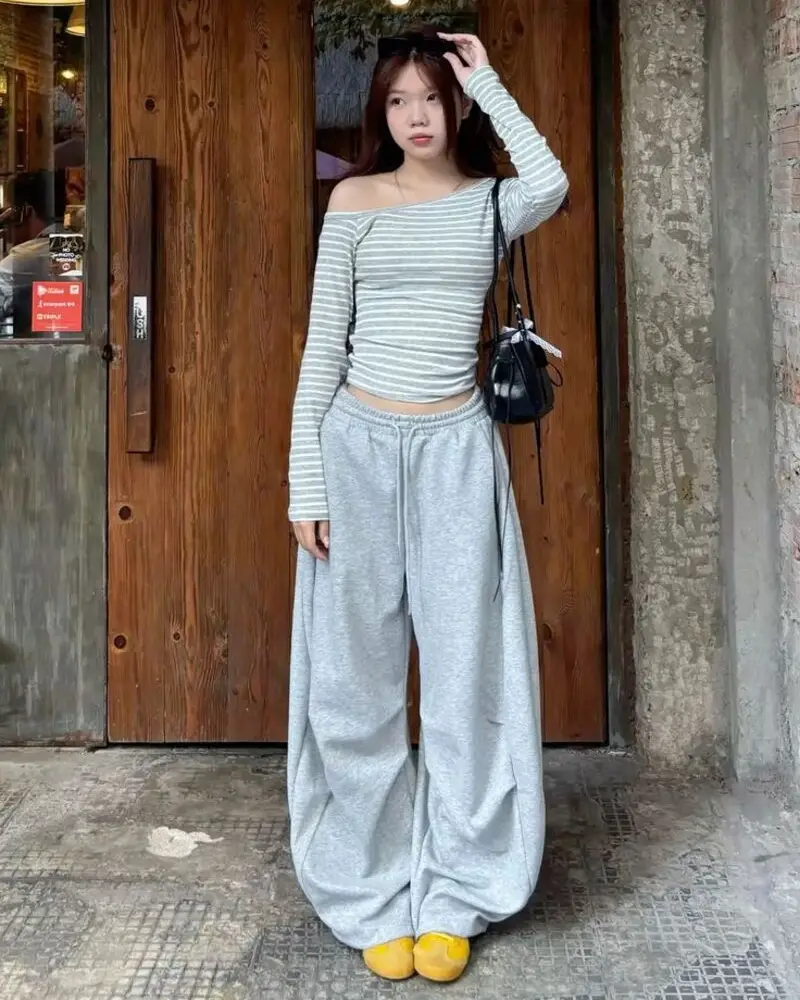 Off-Shoulder Stripe Top and Oversized Grey Sweats Are a Softer Kind of Street Style