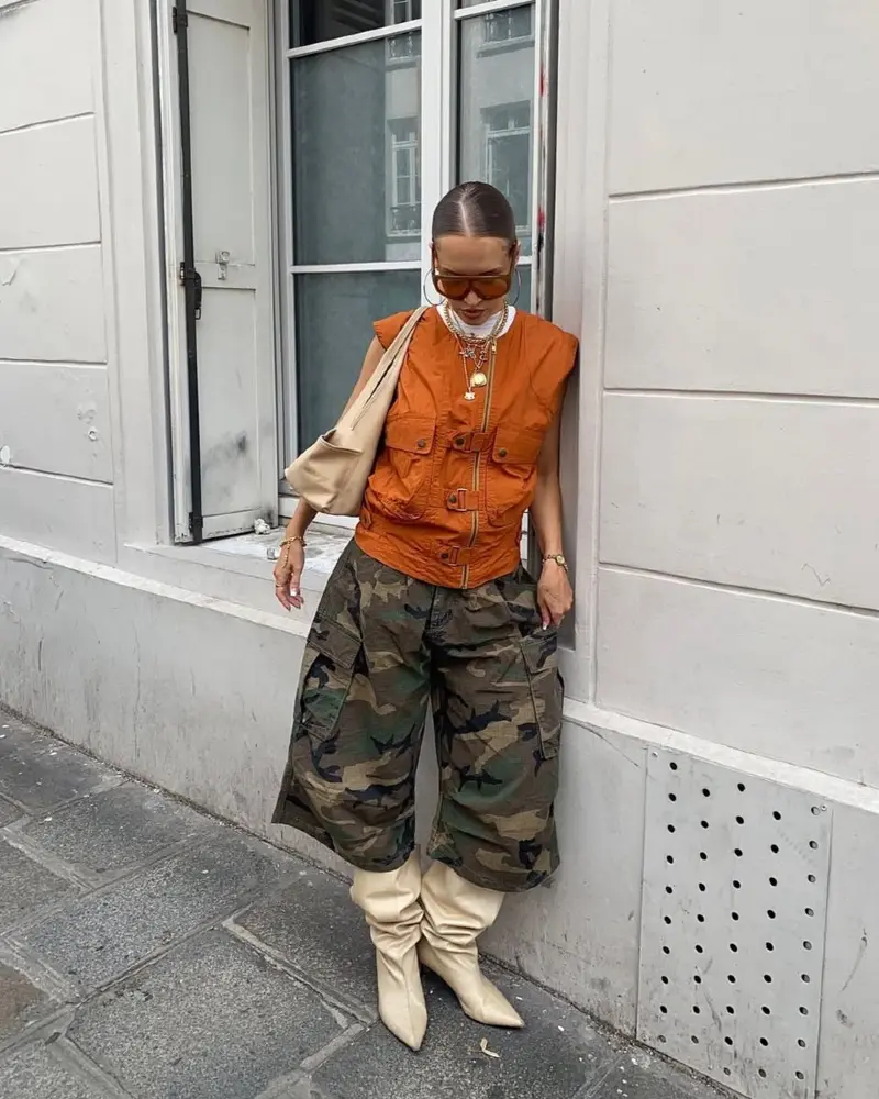 Orange Utility Vest + Camo Wide-Leg Cargo Pants + Cream Boots