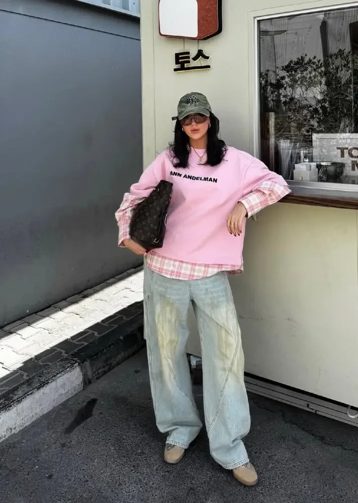 Pink Sweatshirt + Plaid Flannel Layer + Wide-Leg Jeans Formula