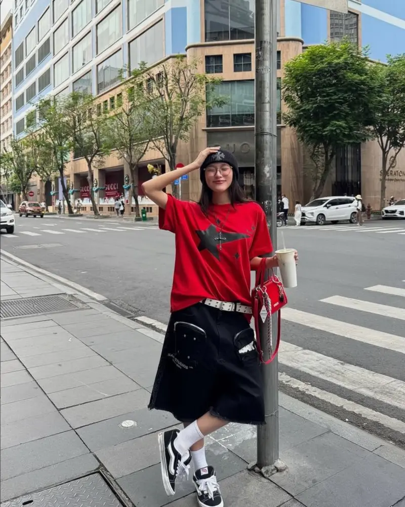 Red Graphic Tee with Black Denim Midi Skirt and Vans