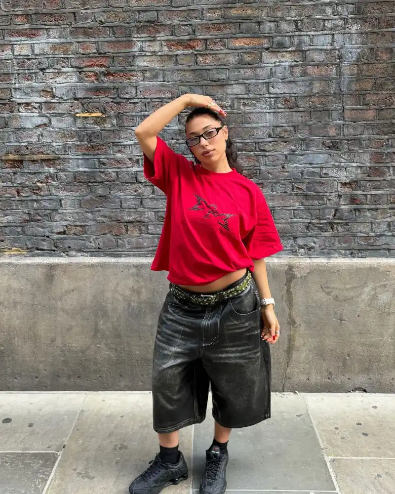 Red Oversized Graphic Tee and Baggy Leather Shorts with Chunky Sneakers