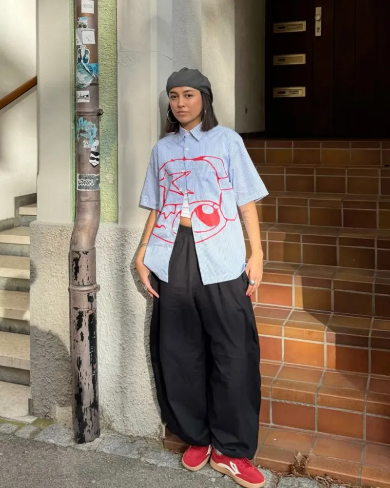 Striped Graphic Shirt + Black Balloon Pants + Red Sneakers 