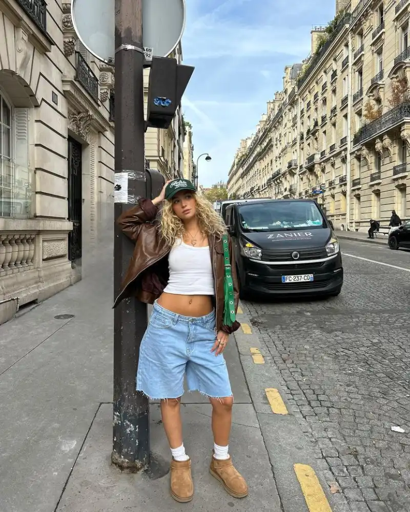 White Crop Tank, Brown Leather Jacket, and Light Wash Raw-Hem Denim Shorts with Boots