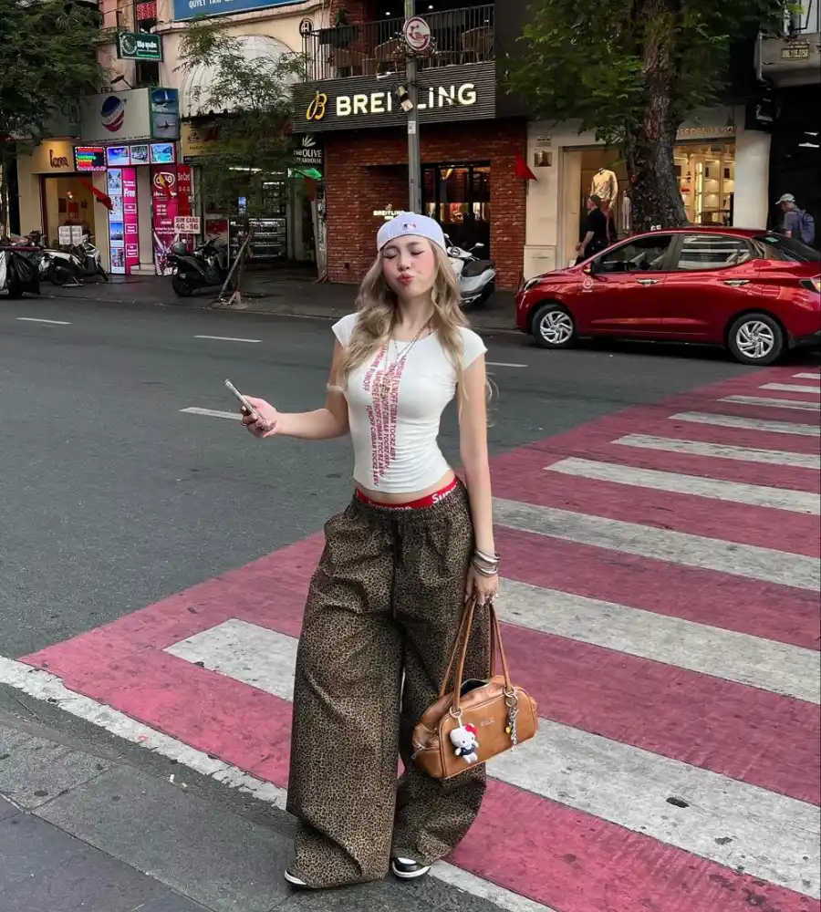 White Graphic Crop Tee with Leopard Print Baggy Pants, Supreme Waistband and NY Cap