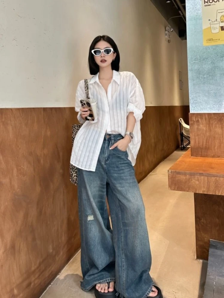 White Linen Shirt + Wide-Leg Distressed Jeans + Chunky Sandals