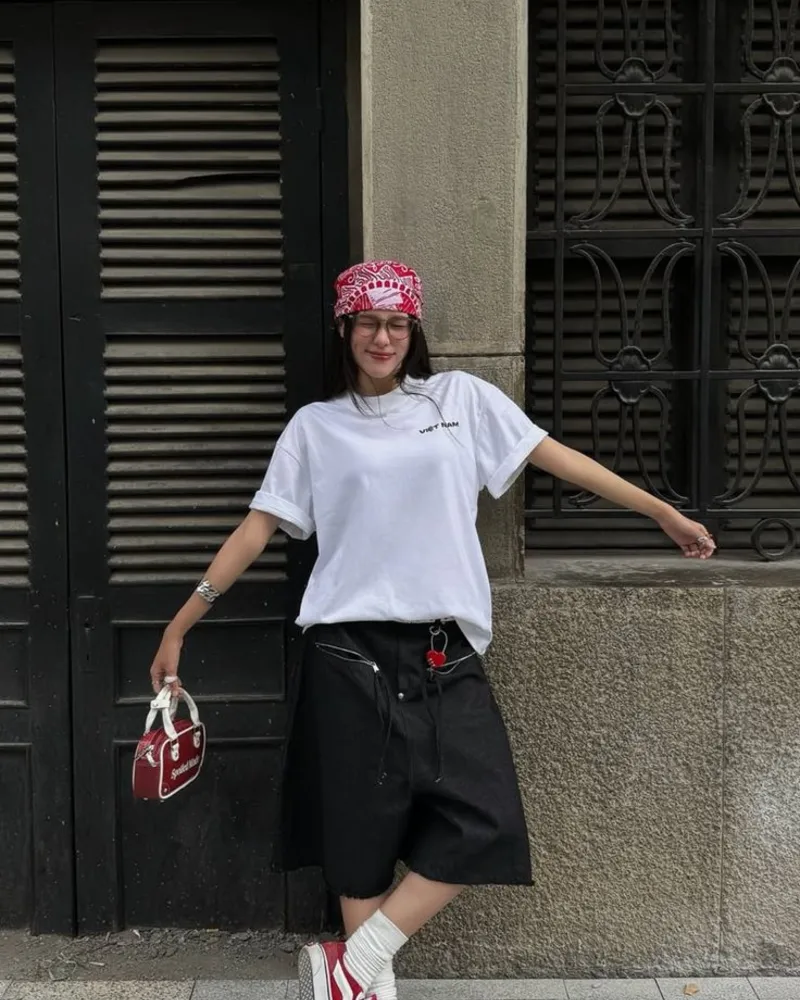 White Vietnam Graphic Tee with Black Denim Jorts, Red Vans, and Red Bandana