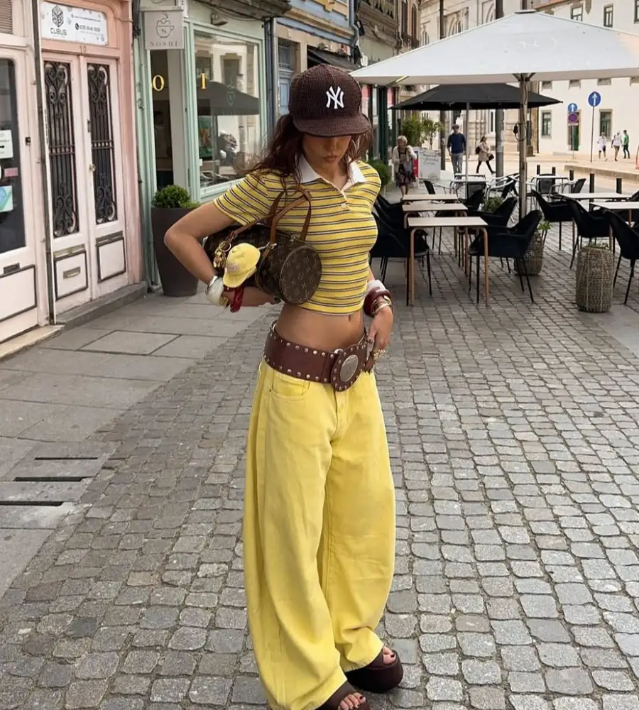 Yellow Striped Crop Polo with Yellow Baggy Jeans, NY Cap, Studded Belt and Platform Slides