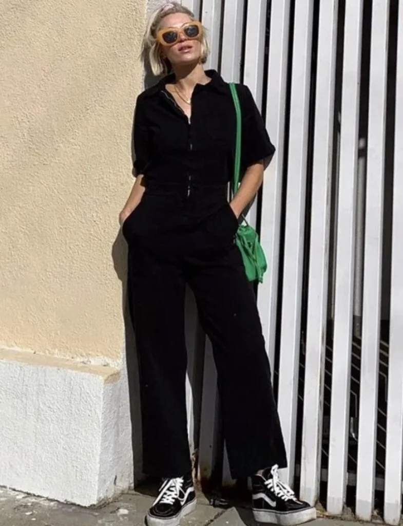 Black Zip-Up Jumpsuit + Green Crossbody Bag