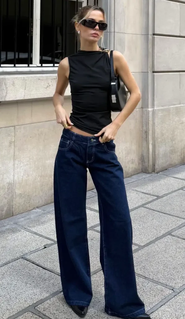 Black draped top, indigo wide-leg jeans