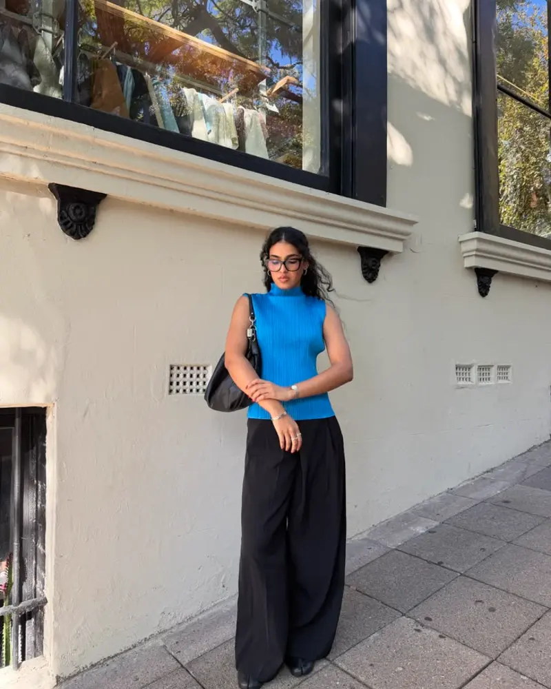 Blue Ribbed Top, Black Pleated Trousers