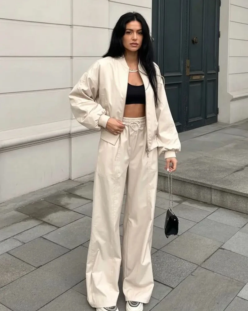 Cream Bomber With a Black Bralette