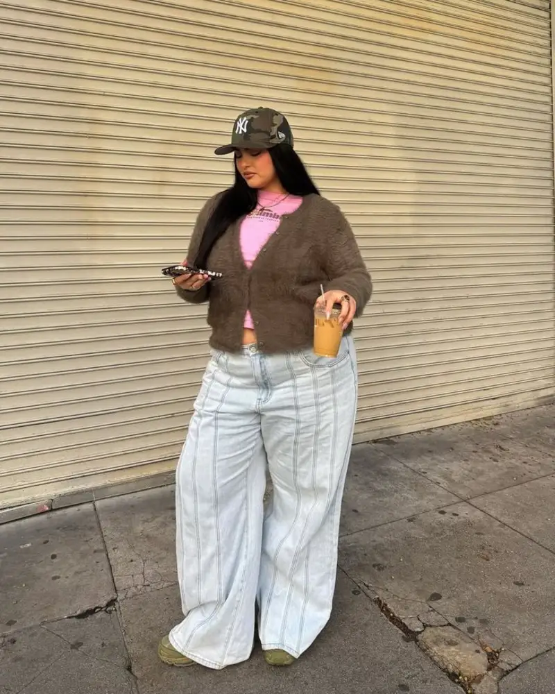 Fuzzy Cardigan Layered Over a Pink Top and Pinstripe Jeans