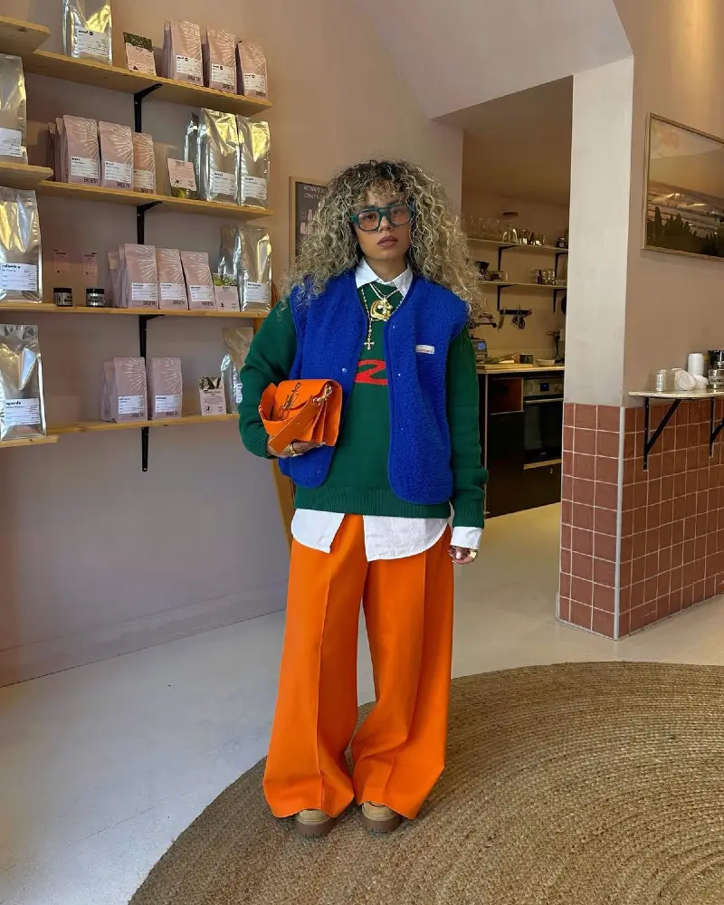  Green Sweater, Blue Vest, and Orange Wide-Leg Trousers