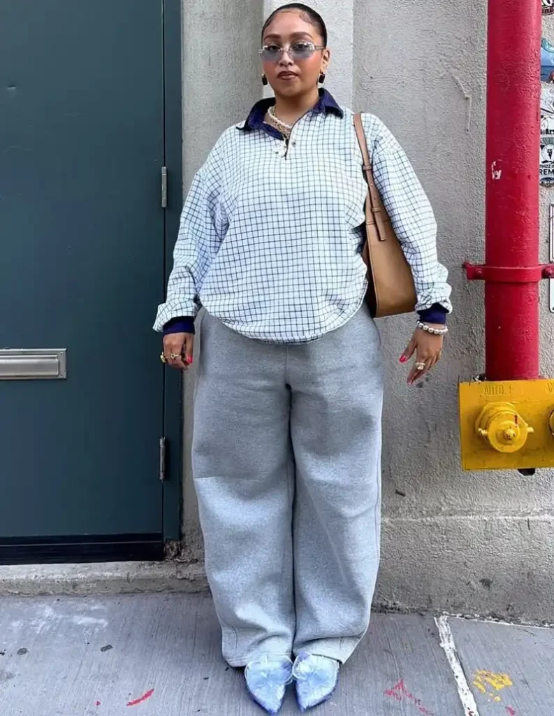 Grid-Print Pullover with Grey Sweatpants and Statement Heels