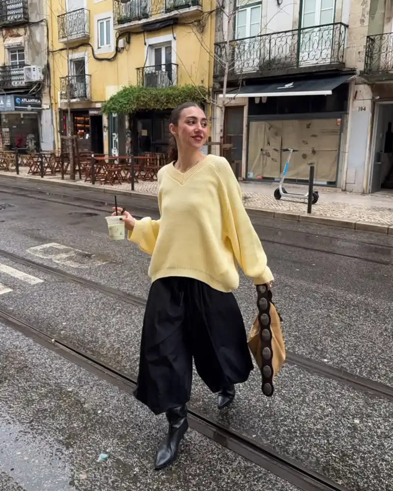 Pale Yellow Sweater and Voluminous Black Trousers