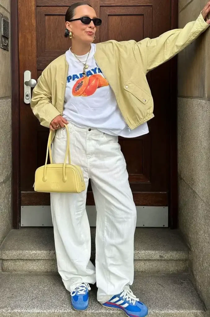 Tan Bomber Over Graphic Tee and White Jeans