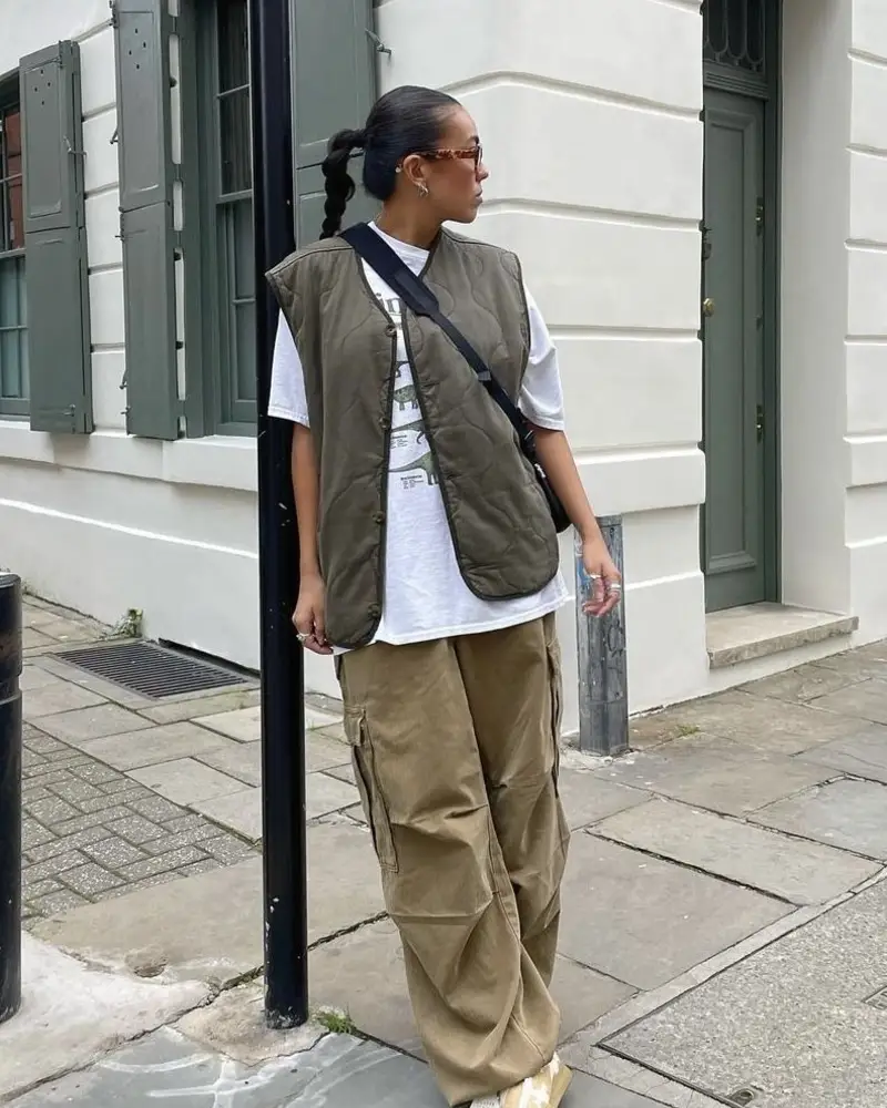 Utility Vest Layered Over A Long Sleeve