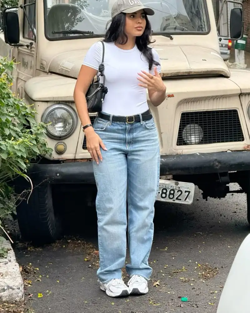 Fitted long-sleeve, wide-leg jeans, chunky sneakers, cap