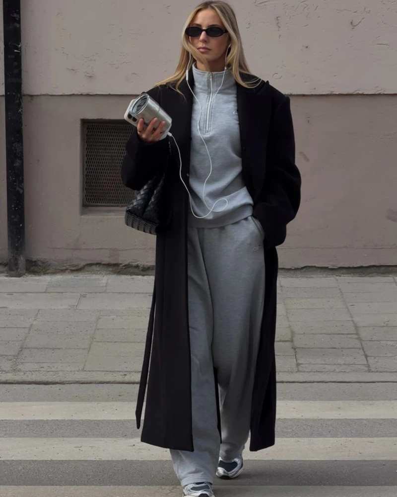 Matching sweats, long coat, and sneakers