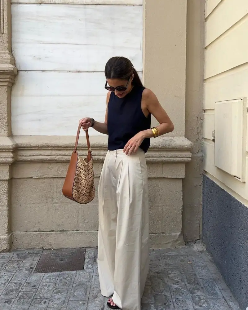 Sleeveless Navy Top and Pleated Cream Trousers