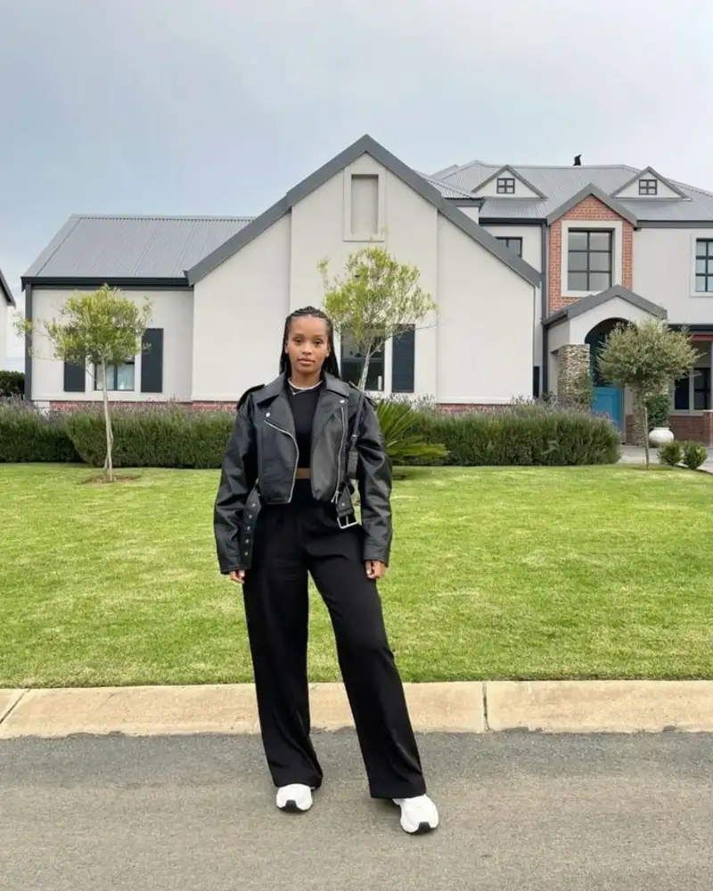 Track pants, fitted knit, and a leather jacket