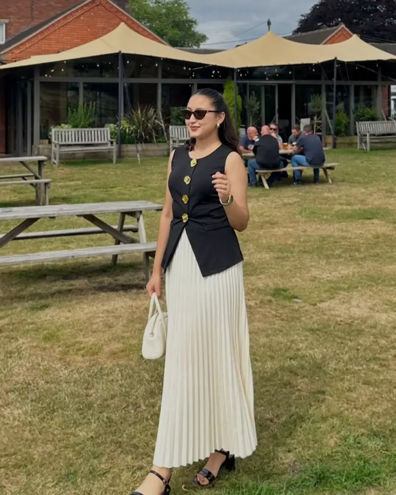 Black Waistcoat and Ivory Pleated Skirt