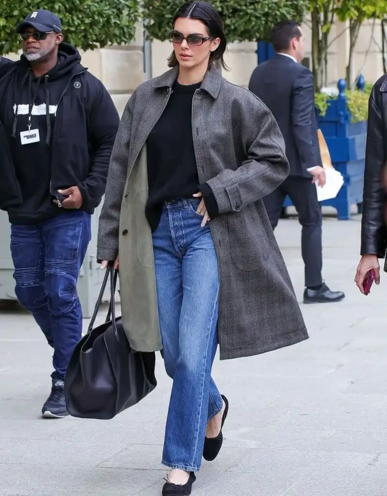 Gray Car Coat With a Black Knit Top and Straight-Leg Jeans