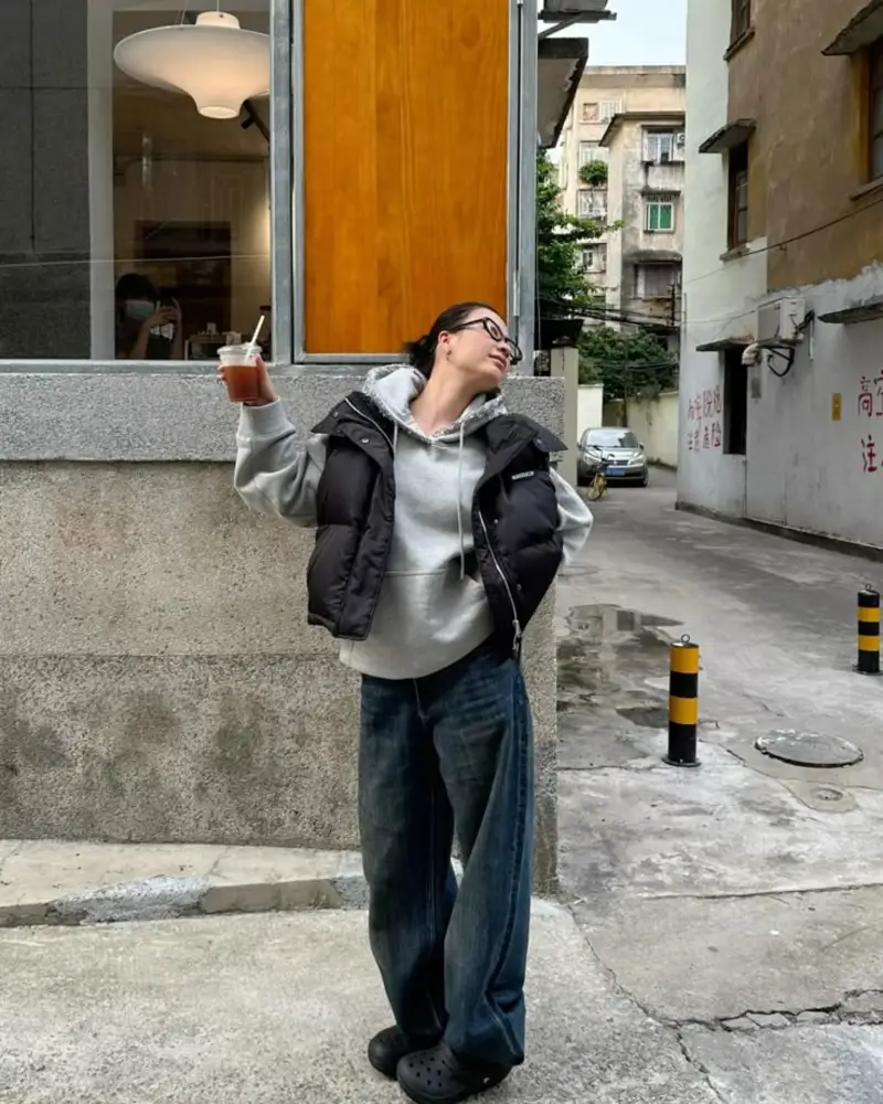 Puffer Vest Over a Gray Hoodie