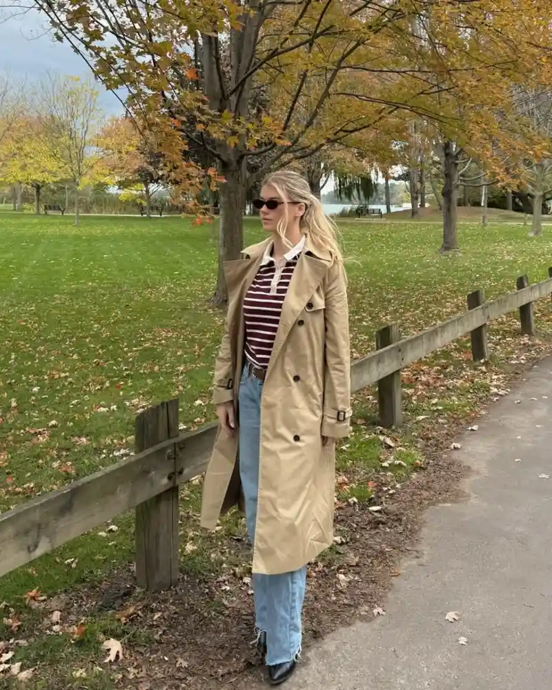 Trench Coat With a Striped Top and Jeans