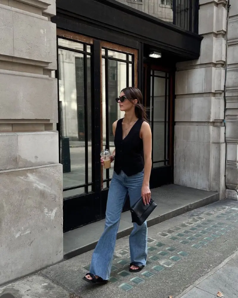 A Black Waistcoat Gives Blue Jeans a Clear Shape