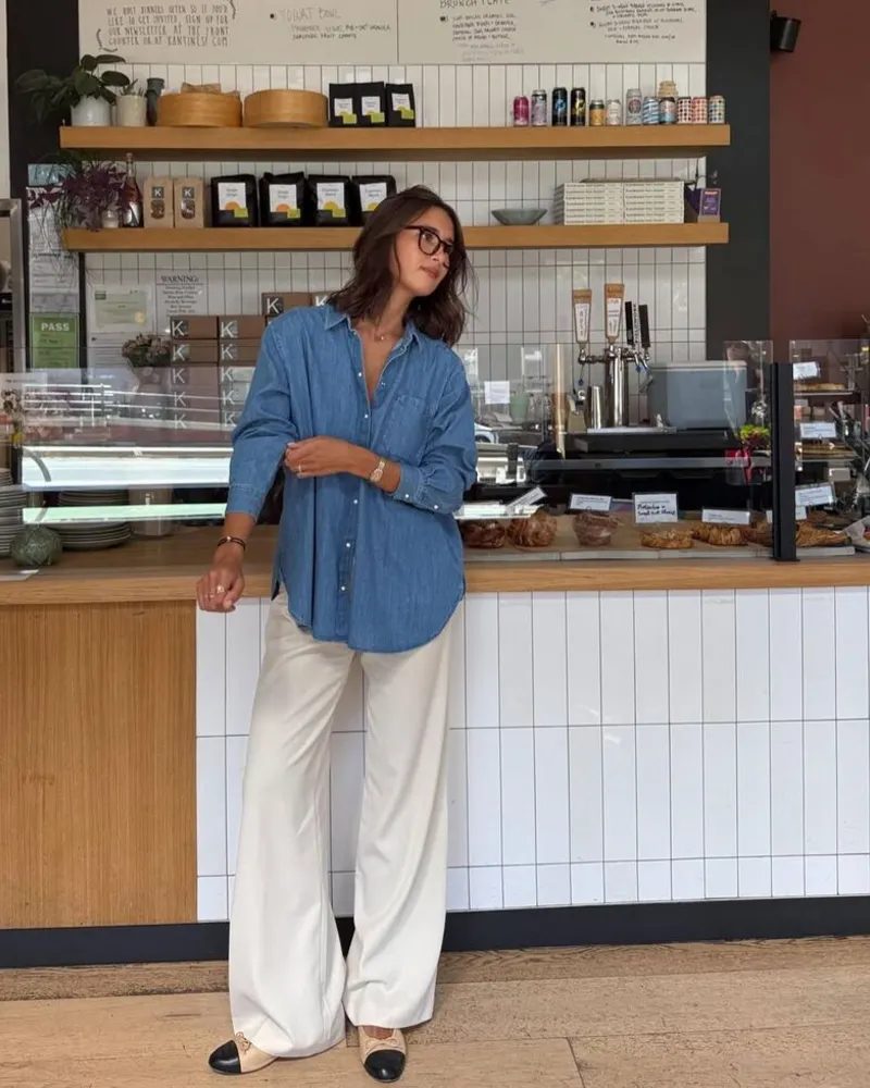 A Denim Shirt Softens Wide Ivory Trousers