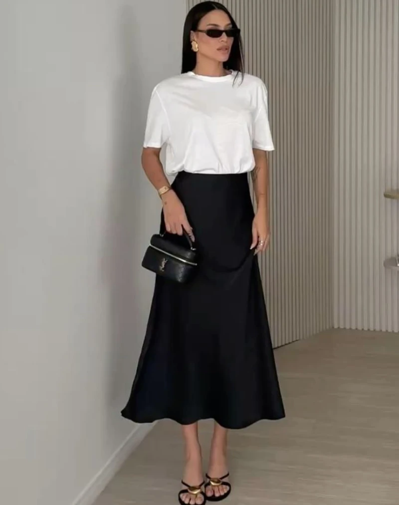 A White Tee Keeps a Black Satin Skirt Approachable
