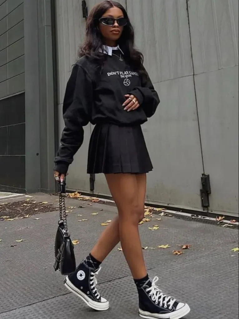 Black Sweatshirt With a Pleated Mini Skirt